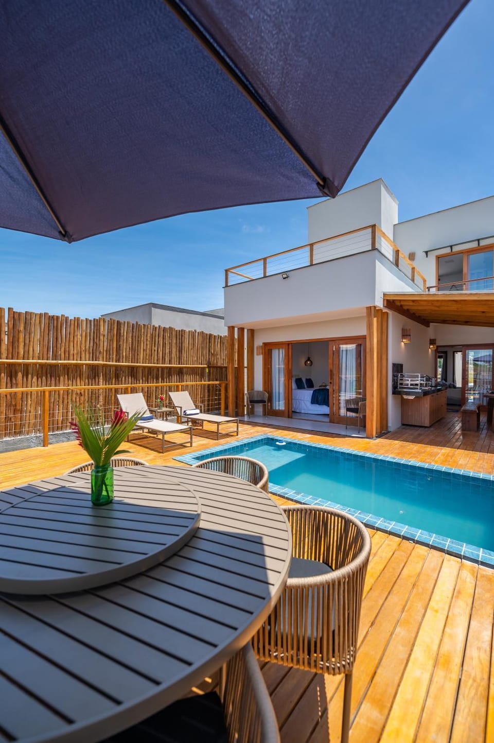 Property building, Patio, Pool view, Swimming pool, sunbed