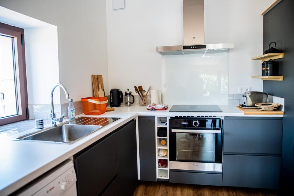 Kitchen or kitchenette, dishwasher, oven, stove, toaster