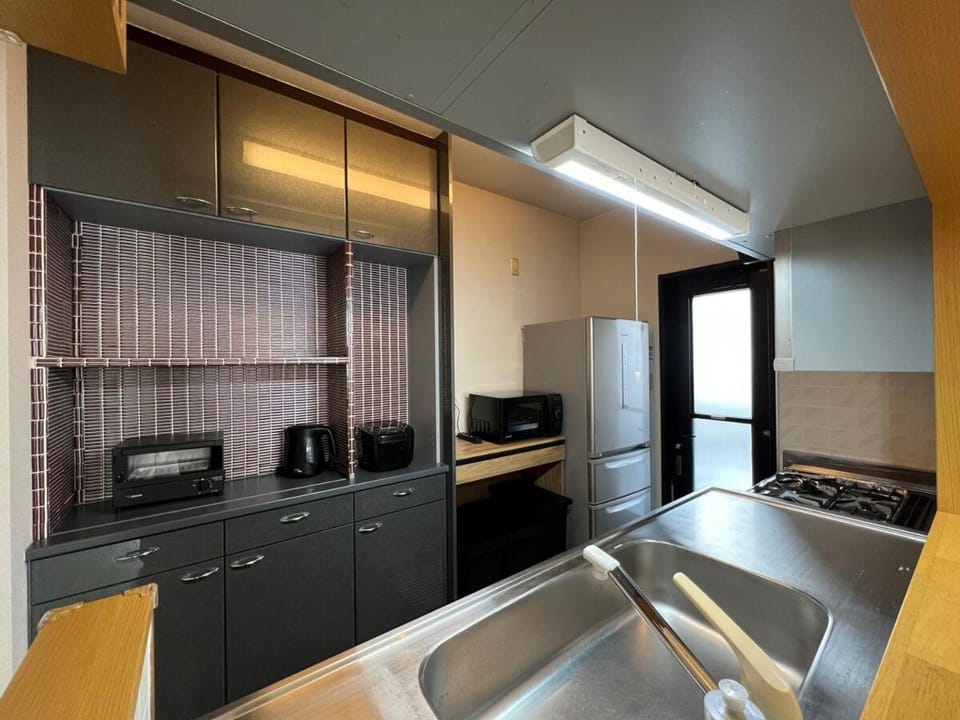 Kitchen or kitchenette, oven, stove, toaster