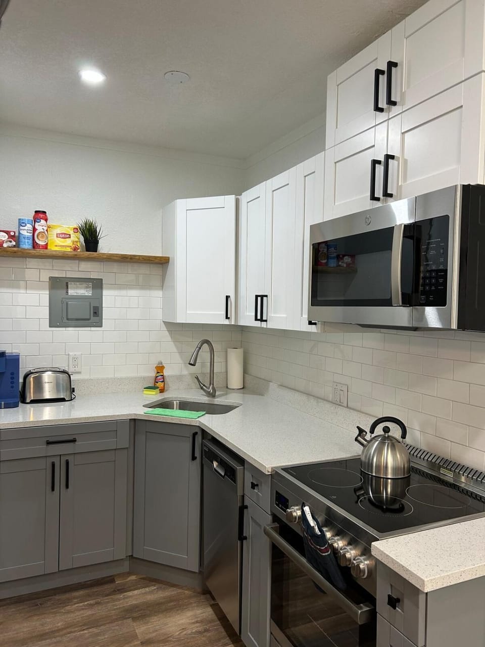 Kitchen or kitchenette, dishwasher, oven, stove, toaster
