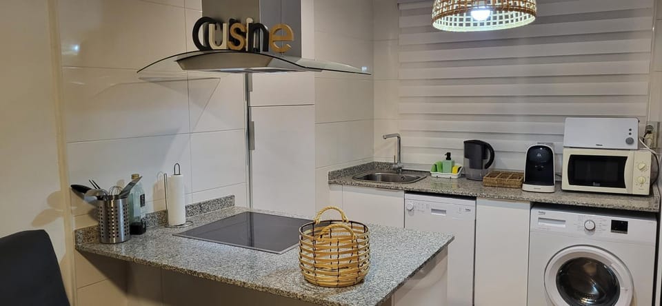 Kitchen or kitchenette, dishwasher, oven, stove, washing machine