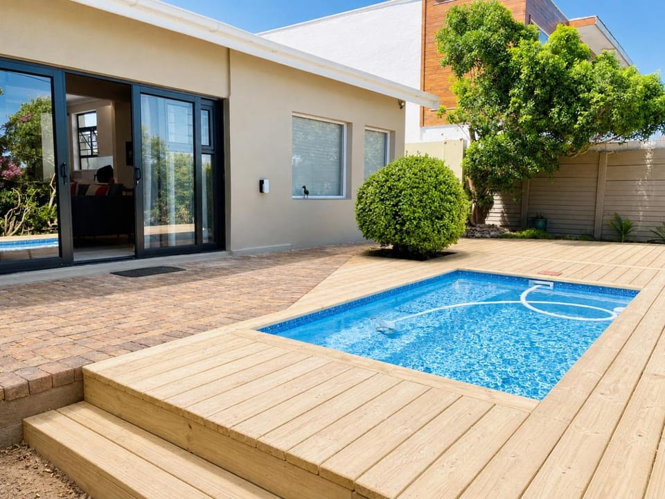 Property building, Patio, Day, Pool view, Swimming pool