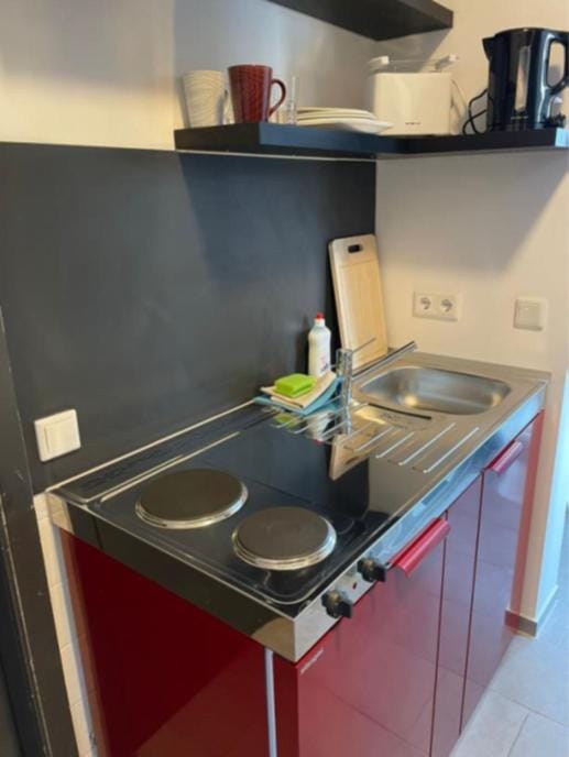 Kitchen or kitchenette, stove