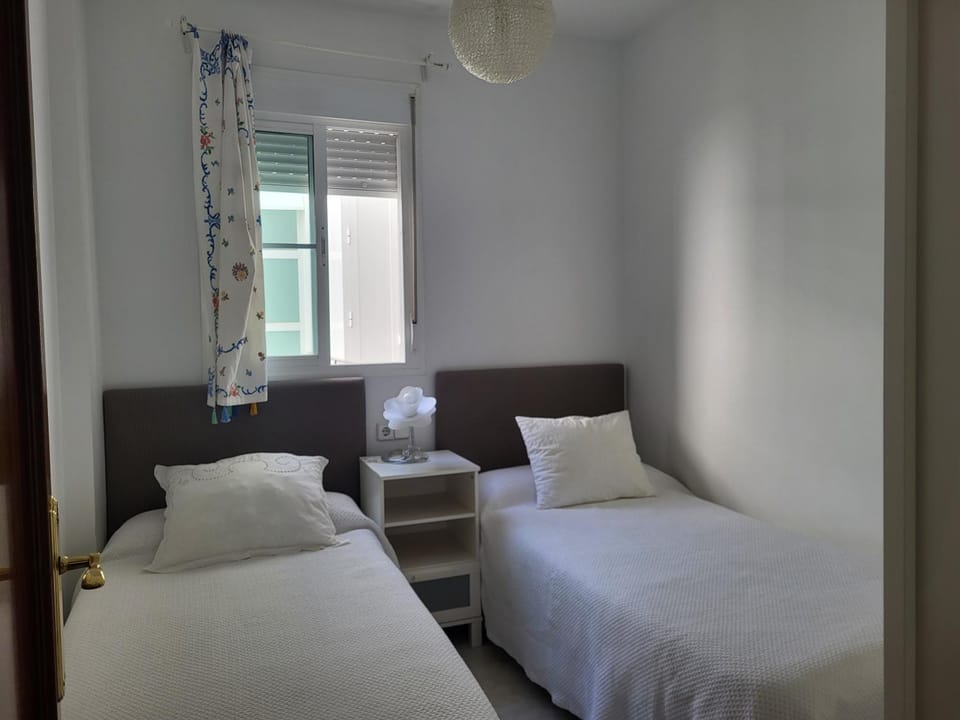 Apartamento en el centro con garaje, terraza, wifi, climatización y piscina Apartment in Sanlúcar de Barrameda