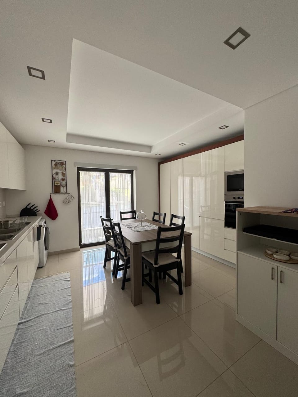 Kitchen or kitchenette, Dining area, dishwasher, stove, washing machine