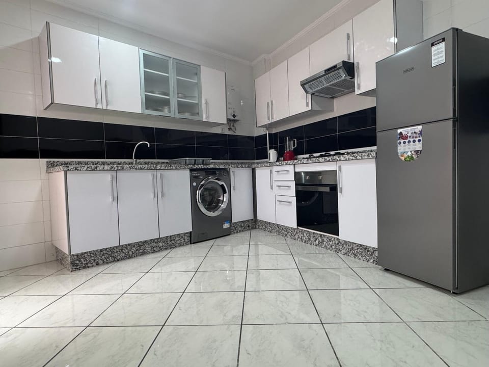 Kitchen or kitchenette, oven, stove, washing machine
