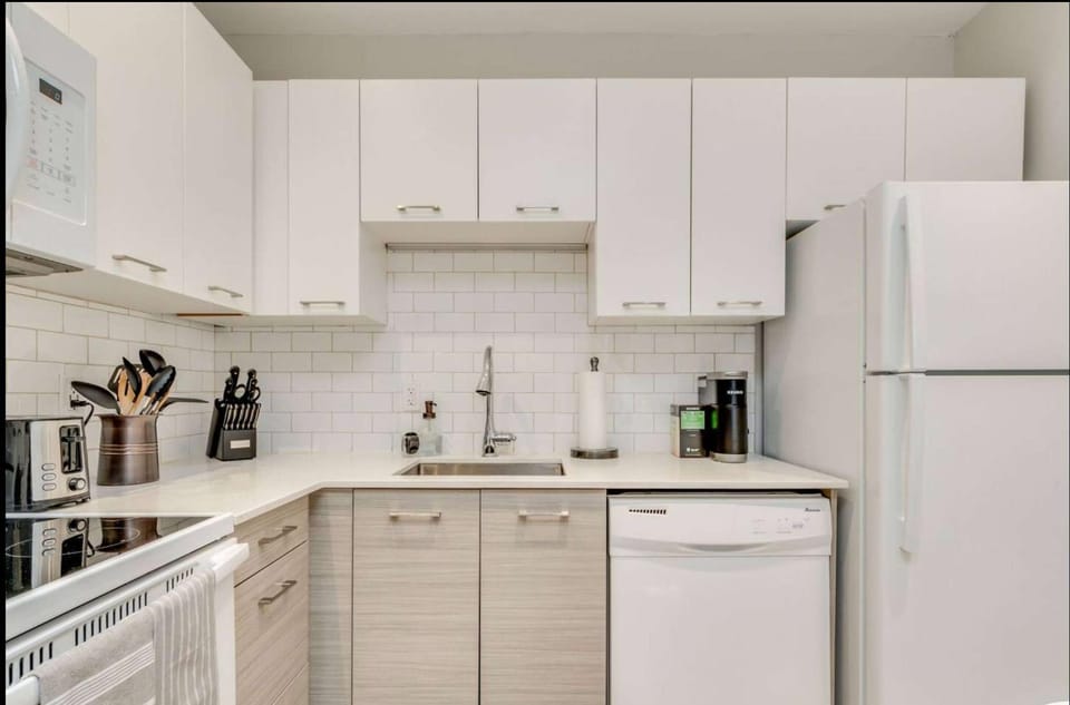 Kitchen or kitchenette, dishwasher, oven, stove, toaster