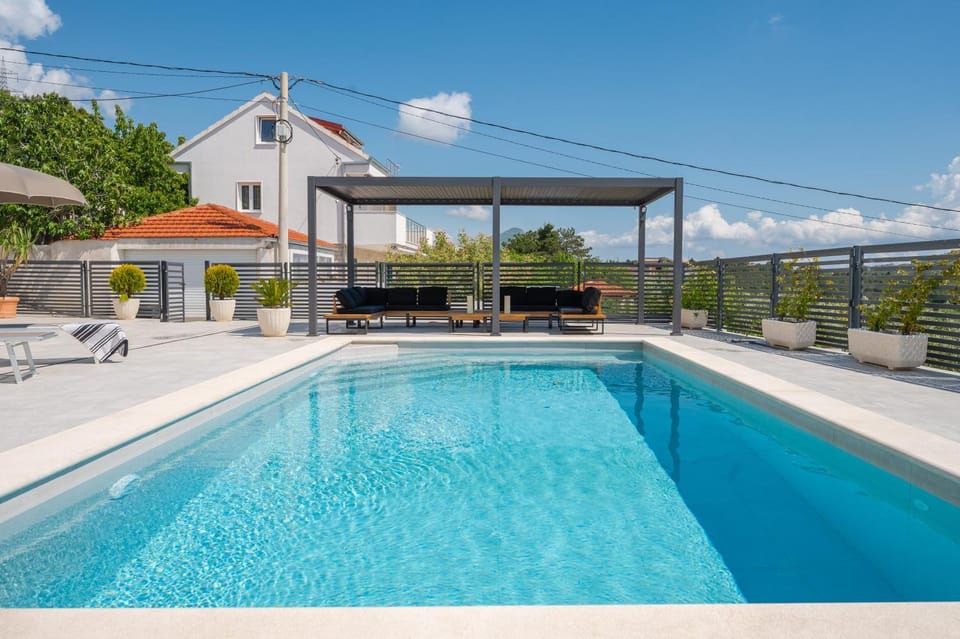 Property building, Day, Natural landscape, Pool view, Swimming pool, sunbed
