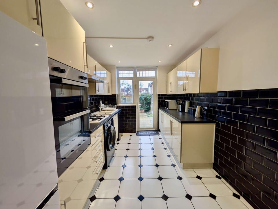 Kitchen or kitchenette, dishwasher, oven, stove