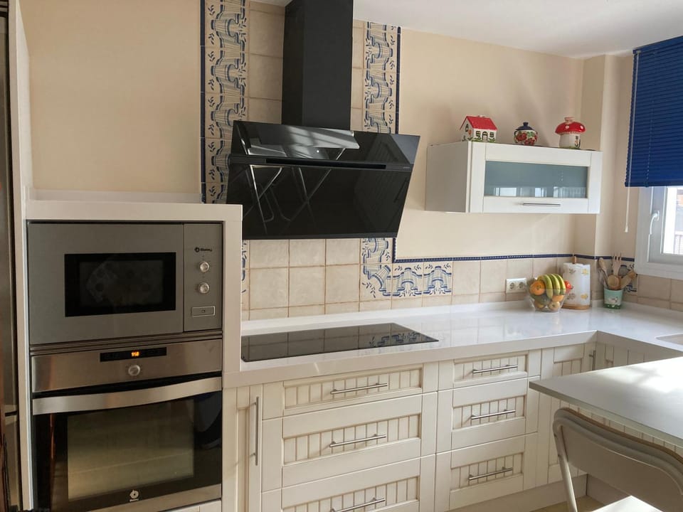 Kitchen or kitchenette, dishwasher, oven, stove