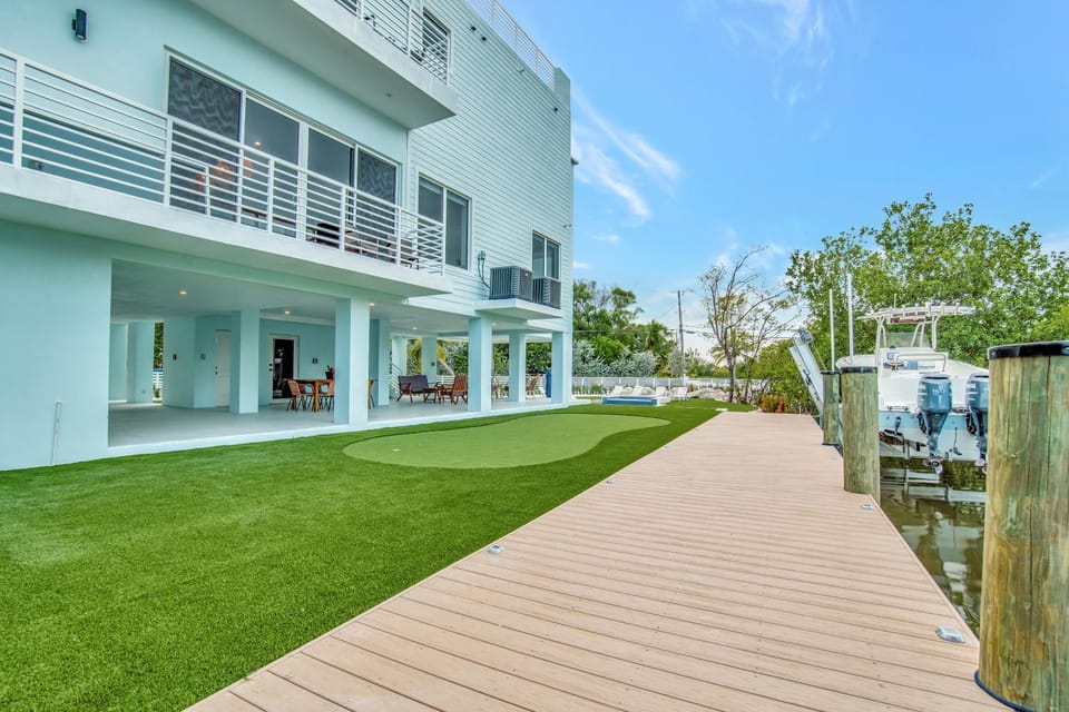 Keys Casa - Elegant Waterfront Retreat, Sleeps 16, Elevator, Private Dock, Putt-Putt House in Key Largo