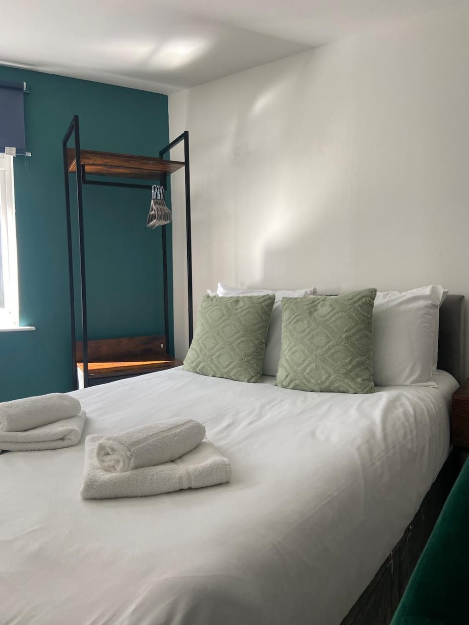Bed, towels, wardrobe