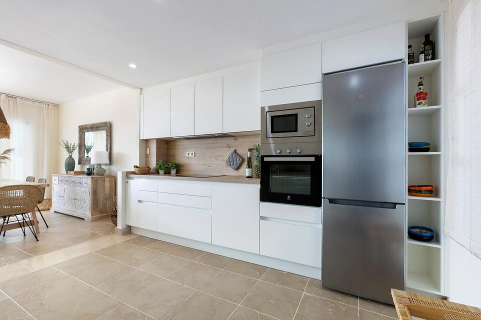 Kitchen or kitchenette, dishwasher, oven, stove