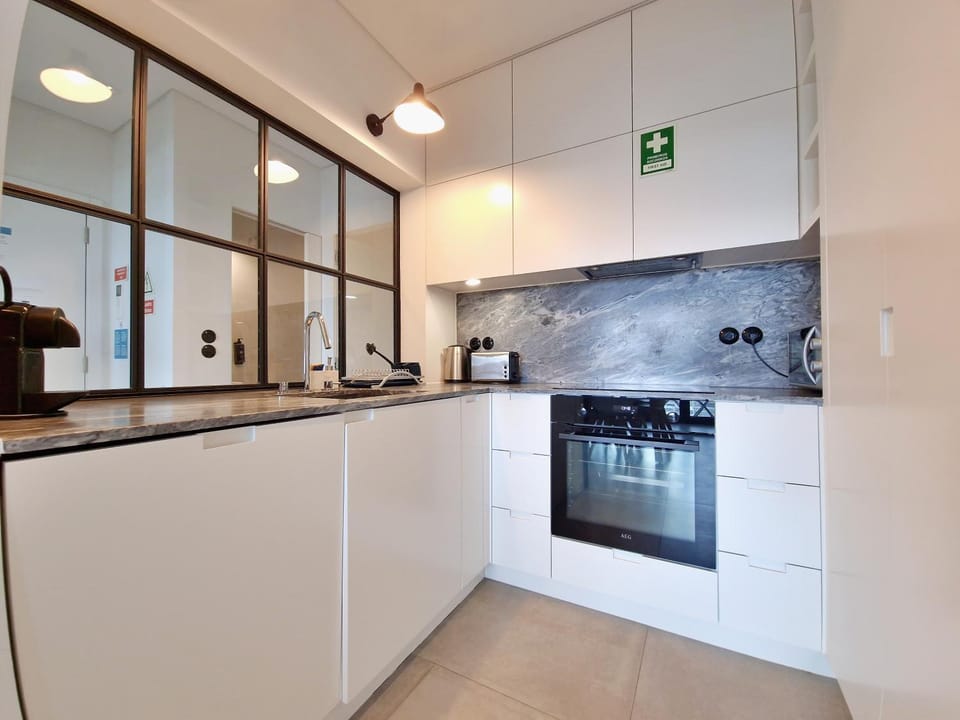 Kitchen or kitchenette, dishwasher, stove, toaster