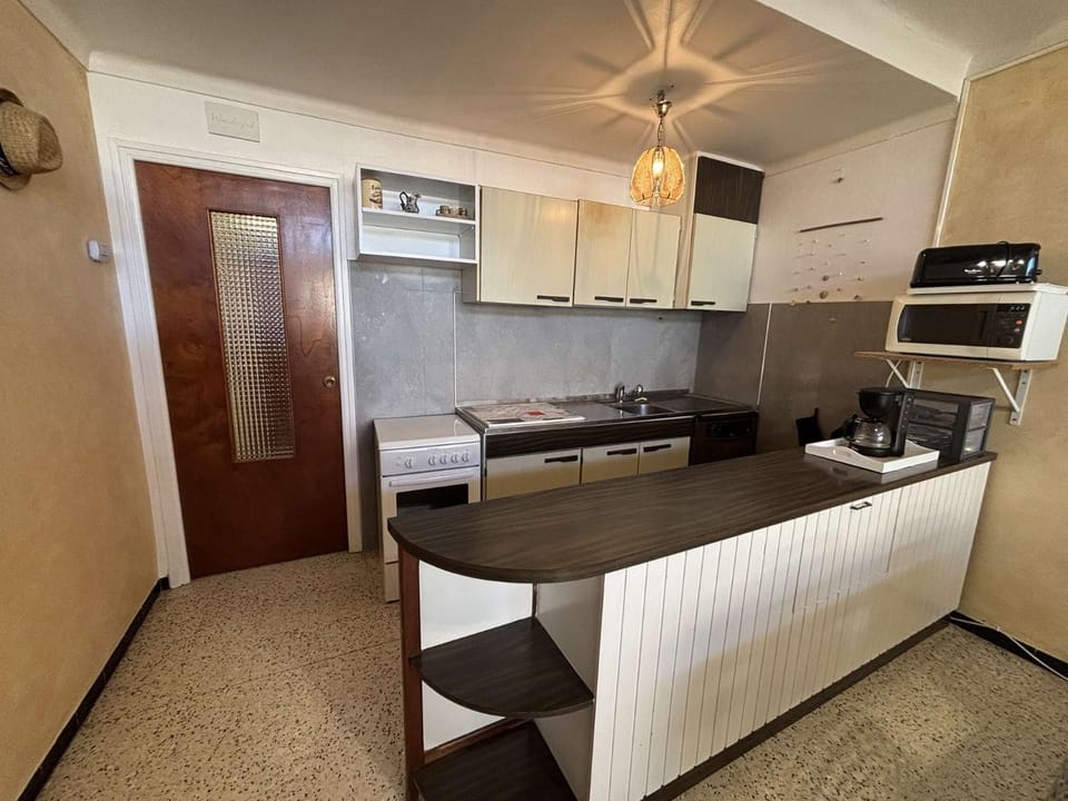 Kitchen or kitchenette, oven, stove, toaster