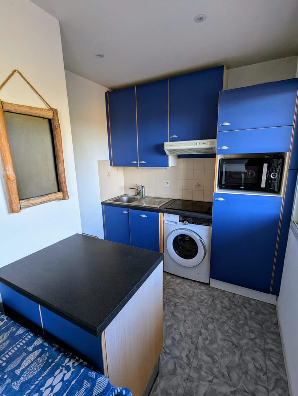 Kitchen or kitchenette, dishwasher, stove, washing machine