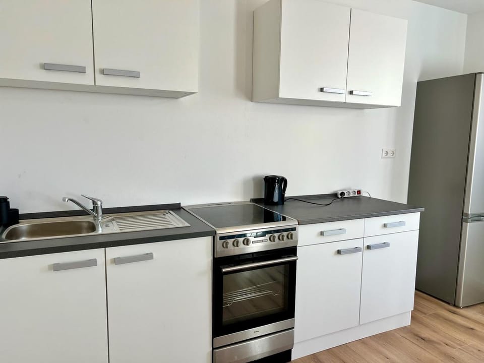 Kitchen or kitchenette, oven, stove
