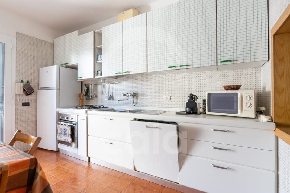 Kitchen or kitchenette, dishwasher, oven, stove