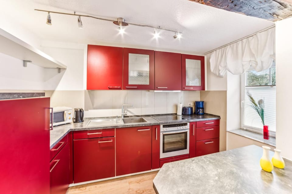 Kitchen or kitchenette, microwave, oven, stove, toaster