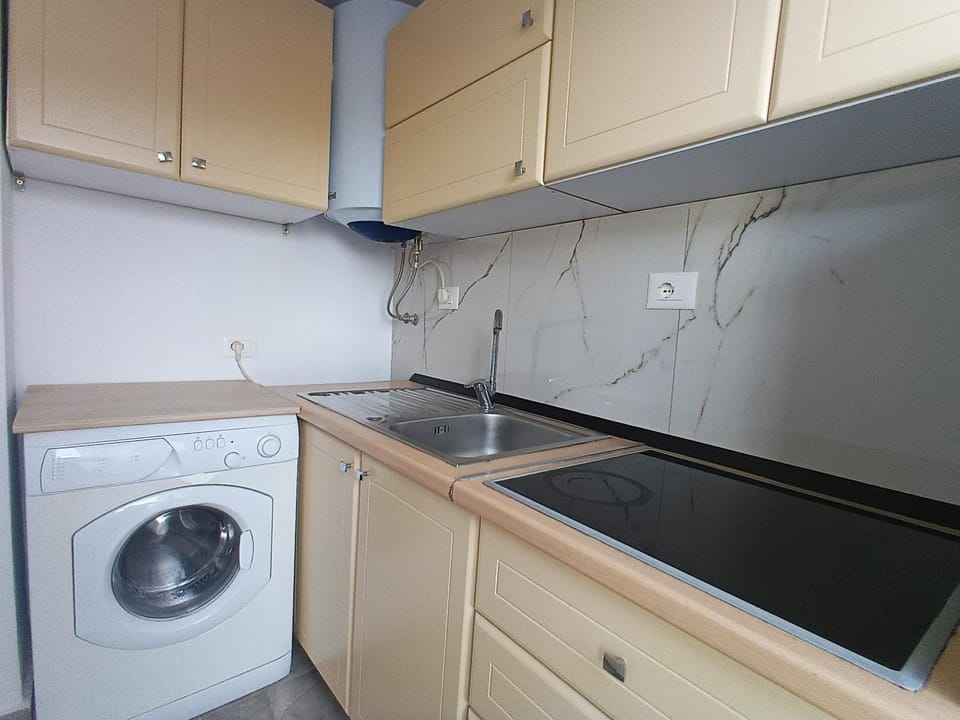 Kitchen or kitchenette, washing machine