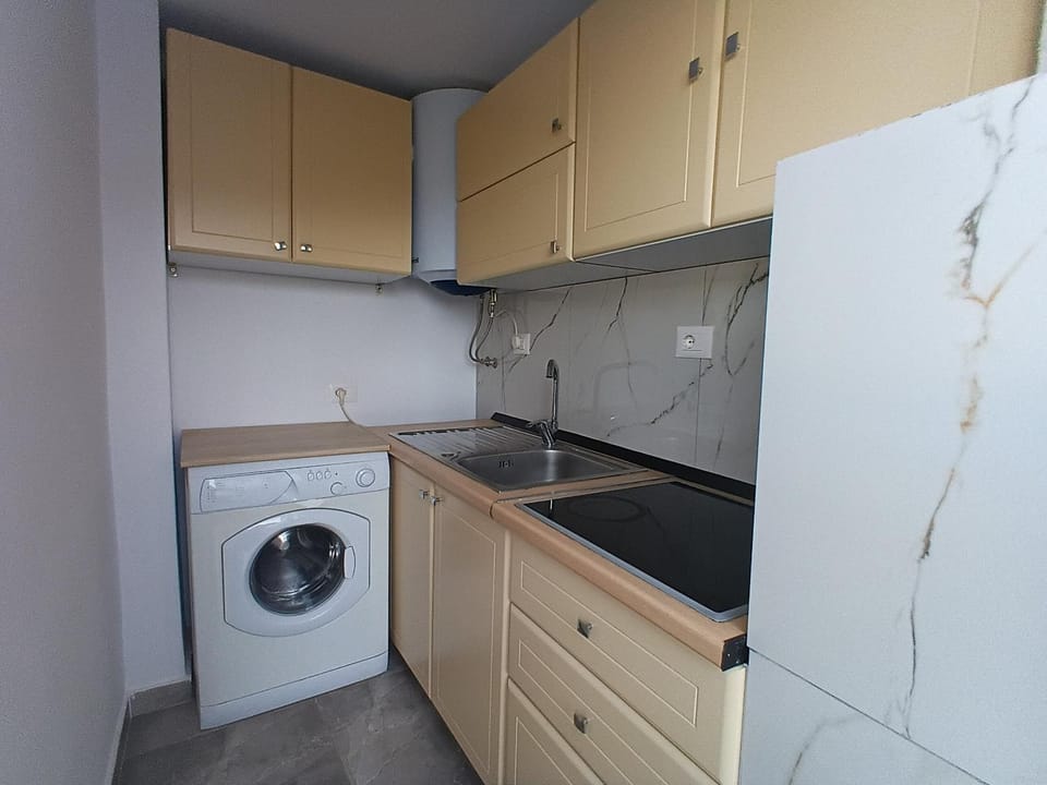Kitchen or kitchenette, washing machine