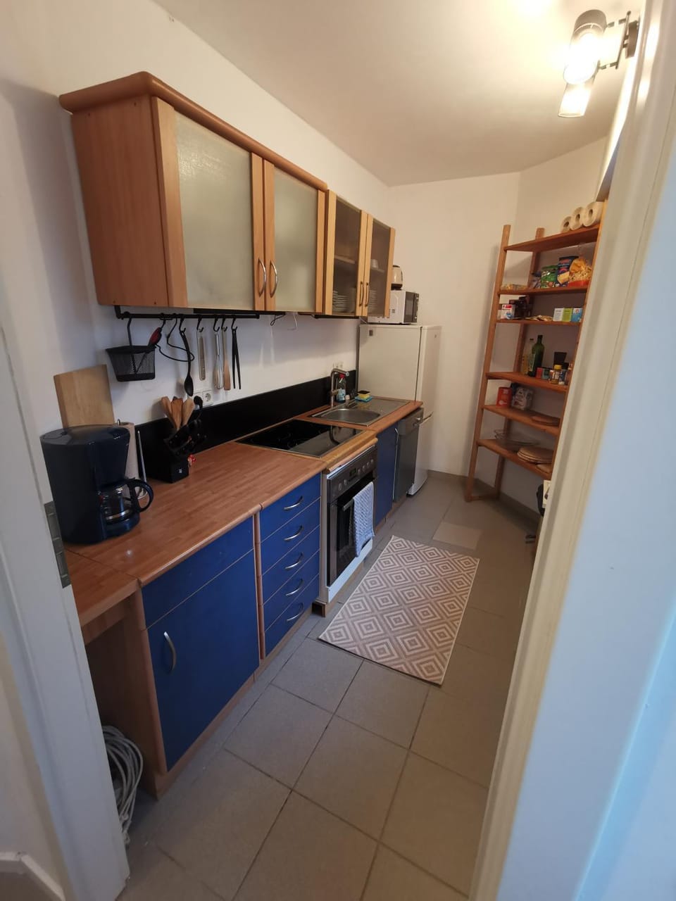 Kitchen or kitchenette, dishwasher, oven, stove