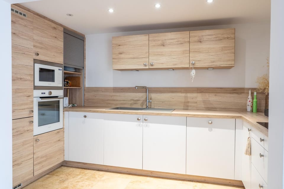 Kitchen or kitchenette, dishwasher, oven, stove