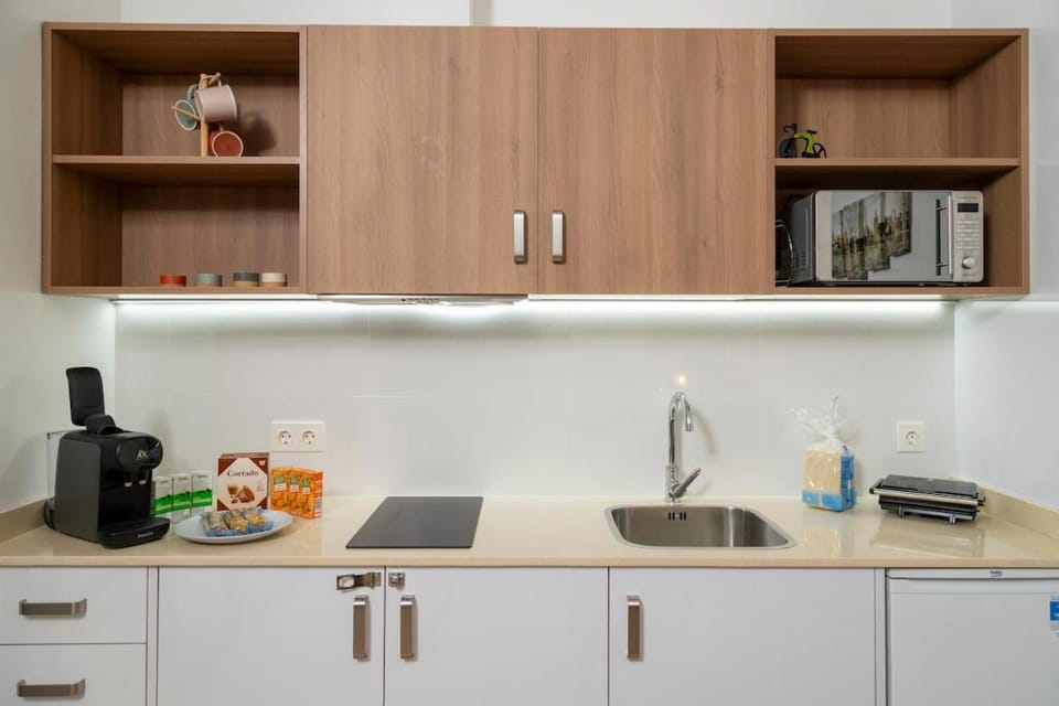 Kitchen or kitchenette, dishwasher, microwave, toaster
