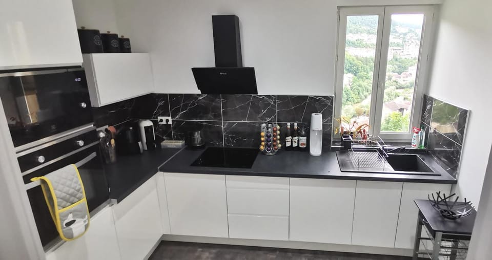 Kitchen or kitchenette, dishwasher, microwave, oven, stove