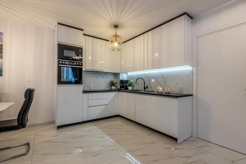 Kitchen or kitchenette, dishwasher, oven, stove