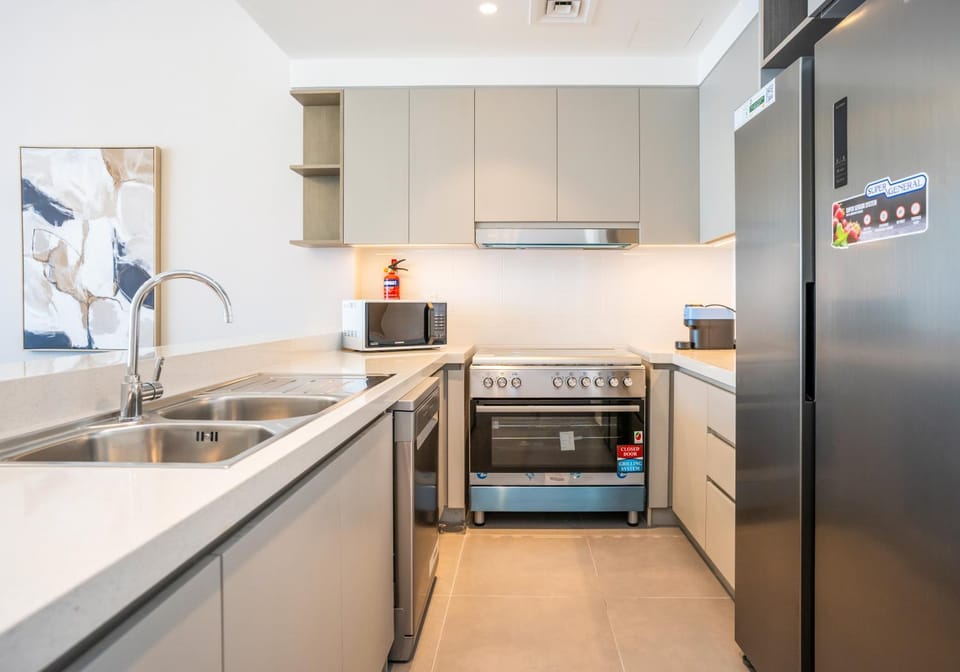 Kitchen or kitchenette, dishwasher, oven, stove