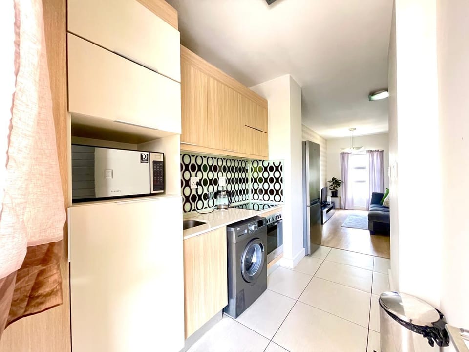 Kitchen or kitchenette, stove, washing machine