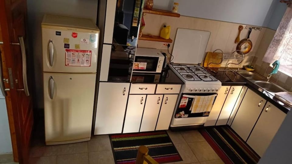 Kitchen or kitchenette, oven, stove
