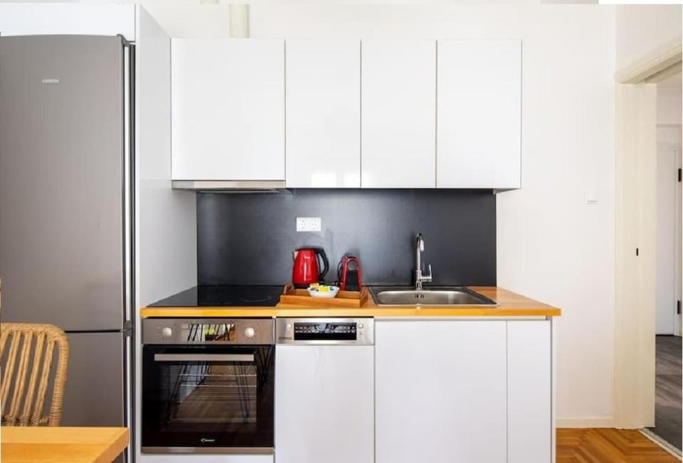 Kitchen or kitchenette, dishwasher, oven, stove