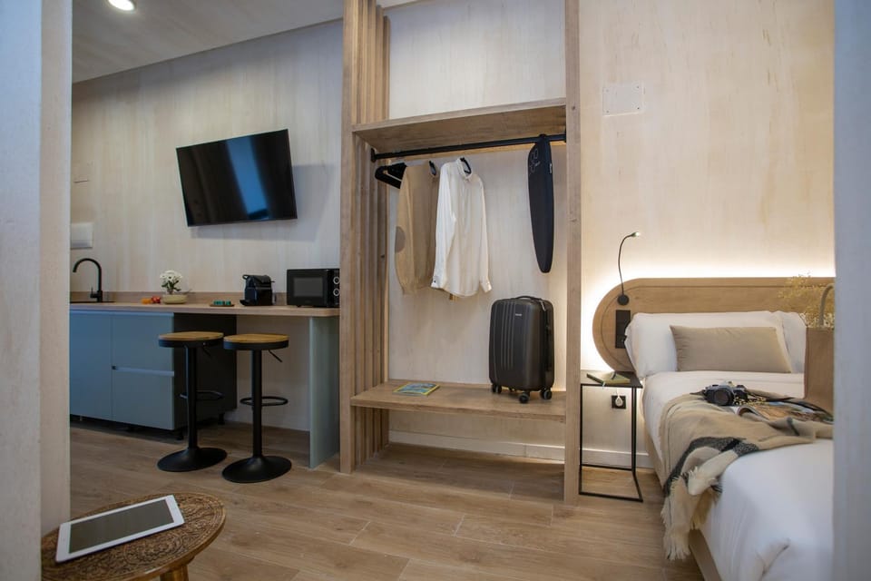 Bed, TV and multimedia, microwave, wardrobe, kitchen