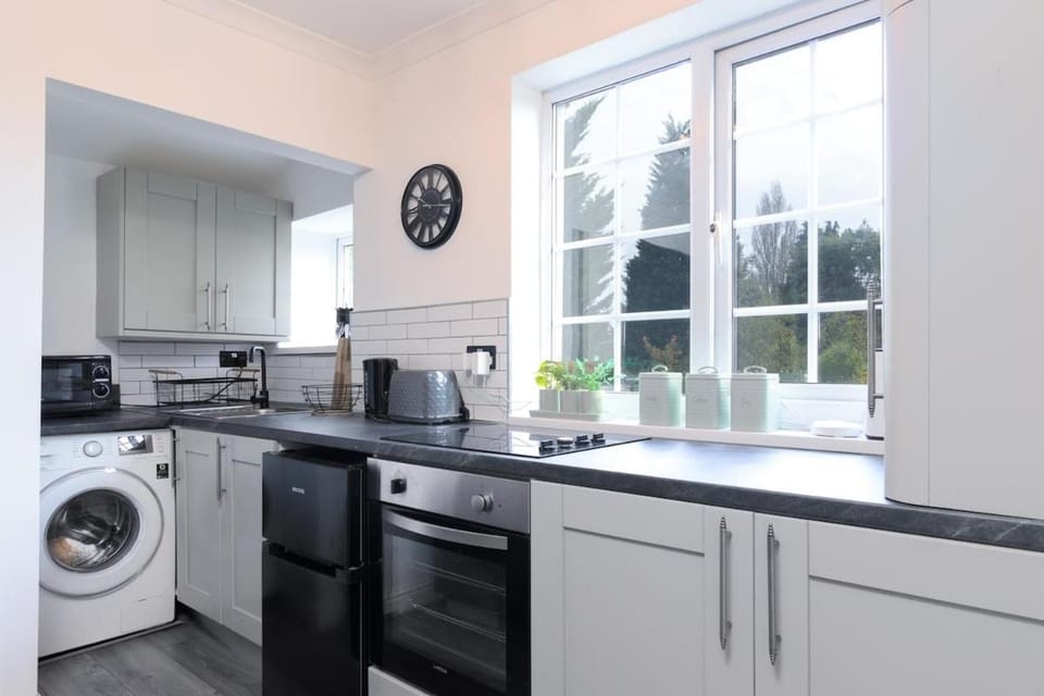 Kitchen or kitchenette, oven, stove, washing machine, dryer