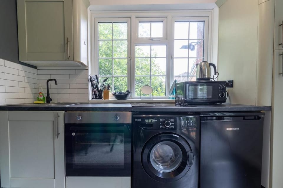 Kitchen or kitchenette, stove, toaster, washing machine, dryer