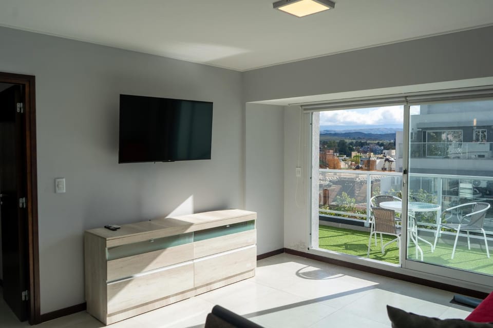 Communal lounge/ TV room, Natural landscape, TV and multimedia, View (from property/room), Living room, Seating area, Mountain view