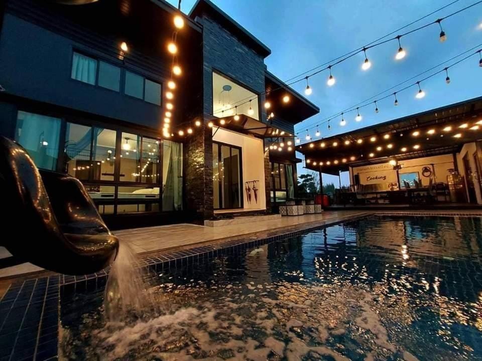 Property building, Patio, Night, Pool view, Swimming pool