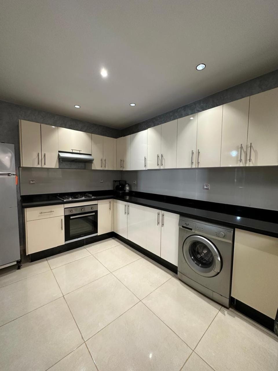 Kitchen or kitchenette, oven, stove, washing machine