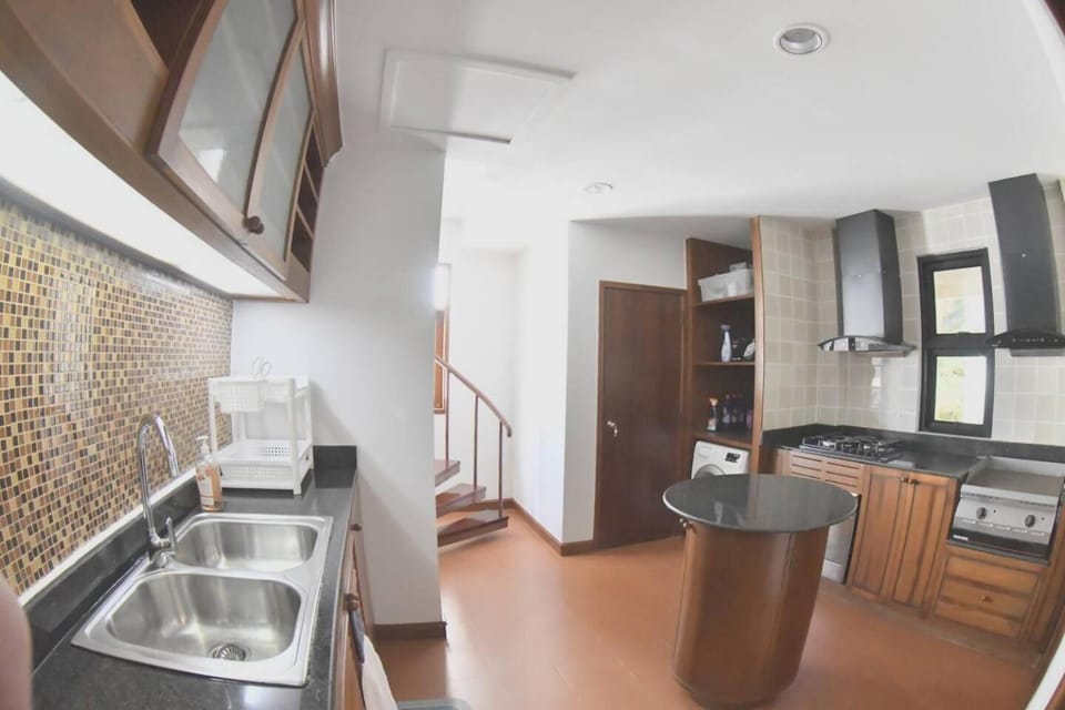 Kitchen or kitchenette, oven, stove, washing machine
