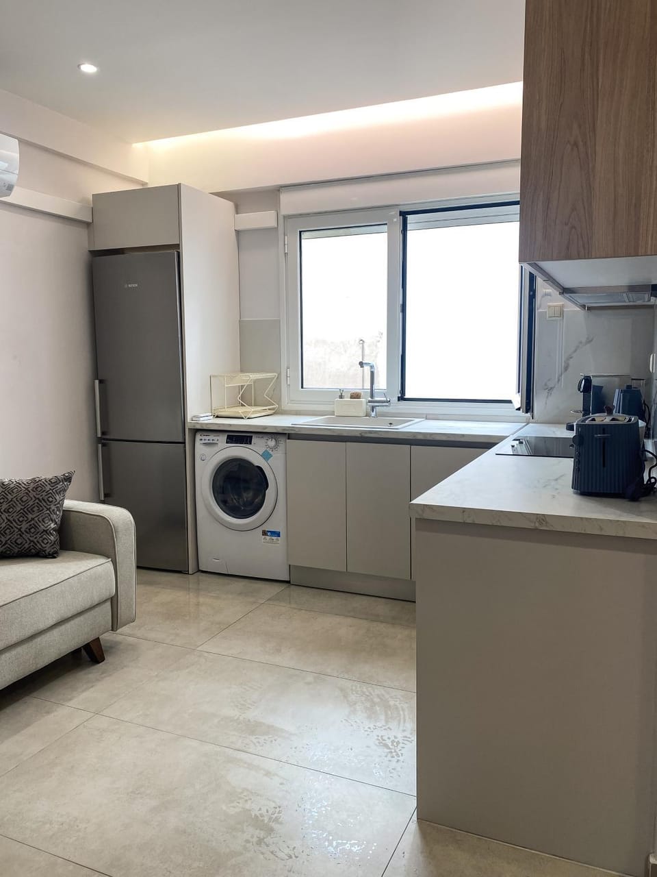 Kitchen or kitchenette, Seating area, washing machine, air conditioner