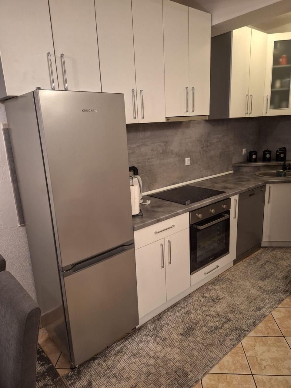 Kitchen or kitchenette, dishwasher, oven, stove