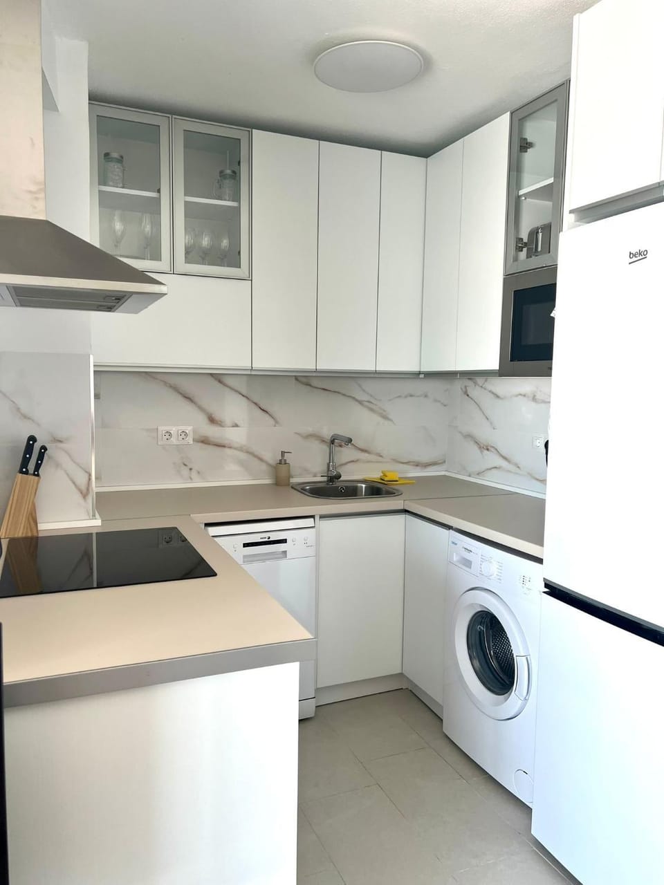 Kitchen or kitchenette, dishwasher, stove, washing machine