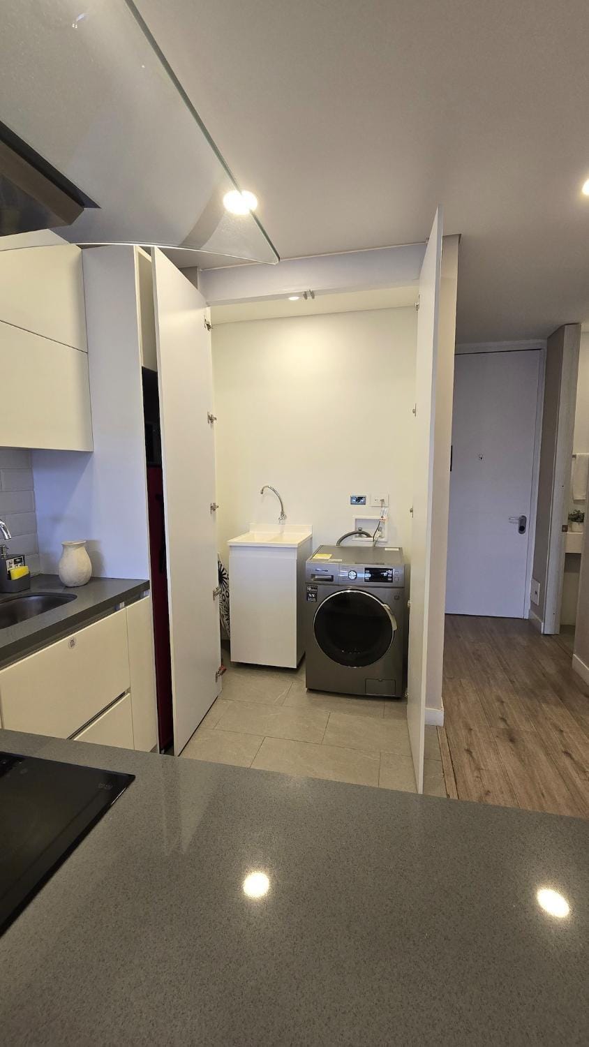 Kitchen or kitchenette, washing machine