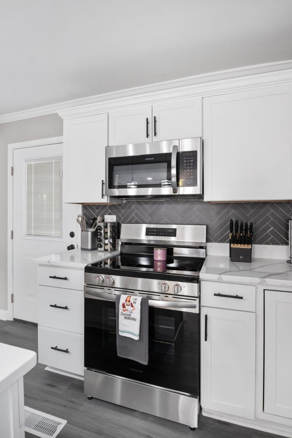 Kitchen or kitchenette, microwave, storage, stove