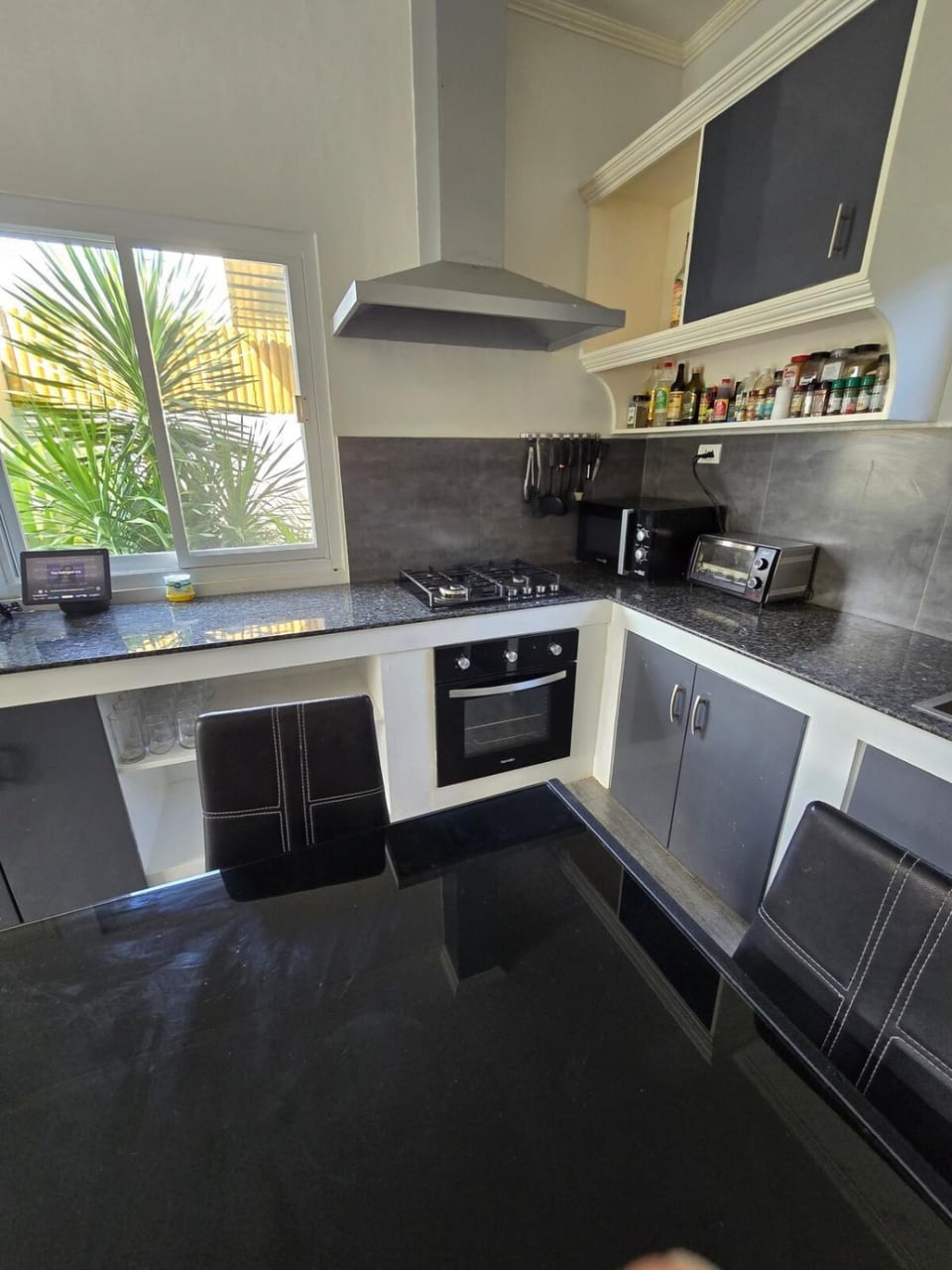 Kitchen or kitchenette, microwave, oven, stove