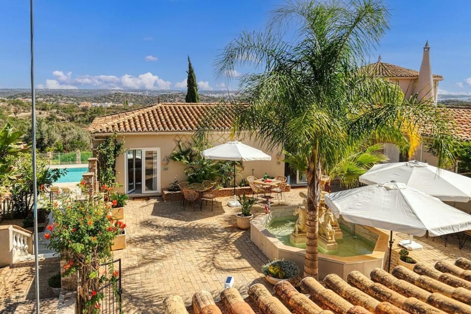 Property building, Patio, Natural landscape, Pool view, Swimming pool, sunbed