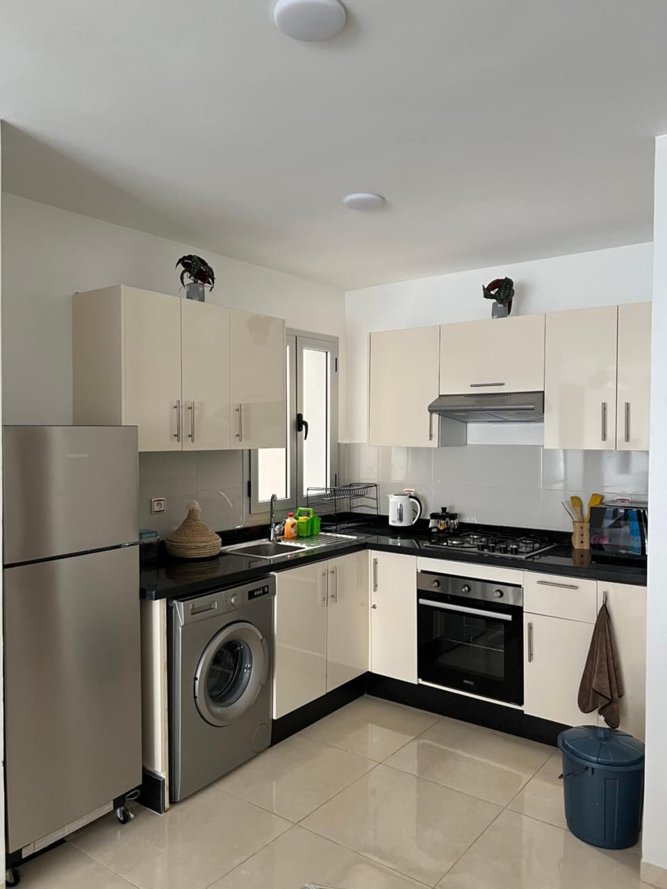 Kitchen or kitchenette, oven, stove, washing machine