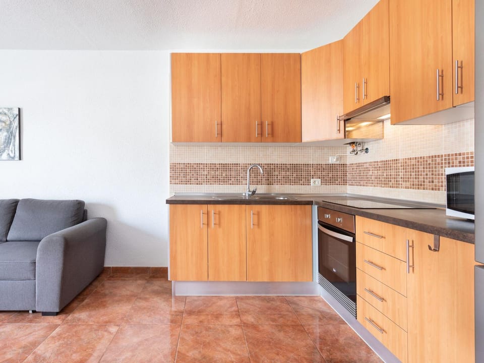 Kitchen or kitchenette, microwave, oven, stove